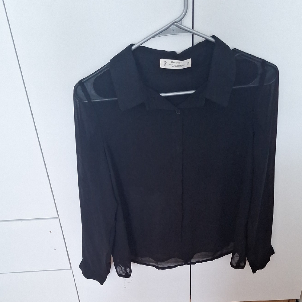 Elegant Black Blouse by [Brand]
